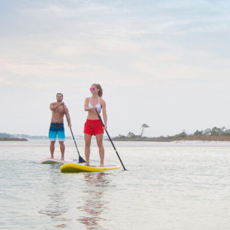 Couple standup paddleboarding