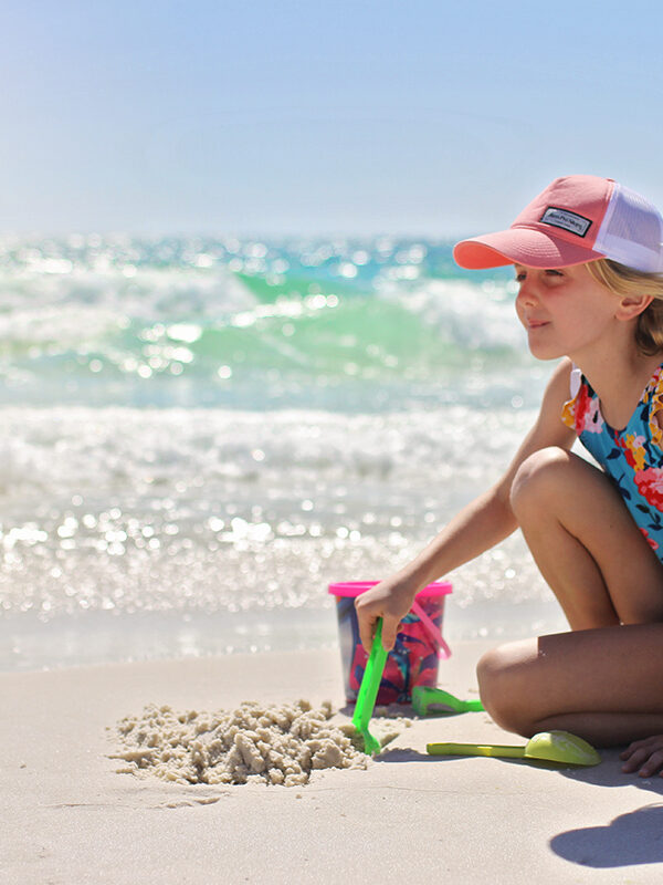 A girl plays in the sand in Destin-Fort Walton Beach, Florida