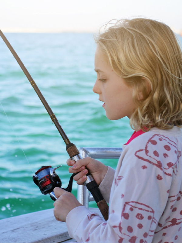 Kid holding fishing rod