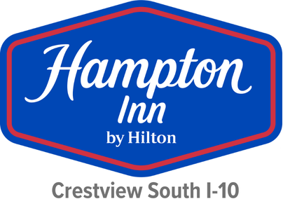 Blue hexagonal Hampton Inn by Hilton logo with red border, and gray text below reading