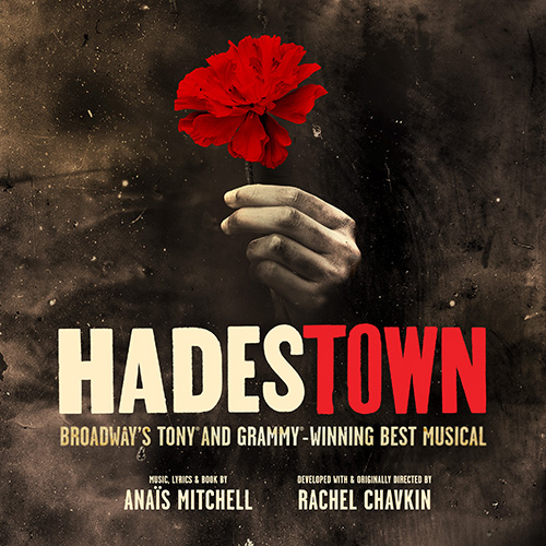 A hand holds a red flower above the title &ldquo;Hadestown,&rdquo; with text stating it is a Tony and Grammy-winning musical by Ana&iuml;s Mitchell and directed by Rachel Chavkin.