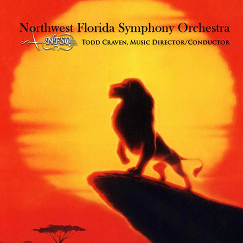 A lion stands on a rock ledge at sunset with a large orange sun behind it. Text at the top reads &ldquo;Northwest Florida Symphony Orchestra.&rdquo;.