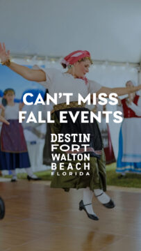 Woman in traditional dress dances at a fall event; other dancers in similar attire perform in the background. Text promotes fall events in Destin-Fort Walton Beach, Florida.