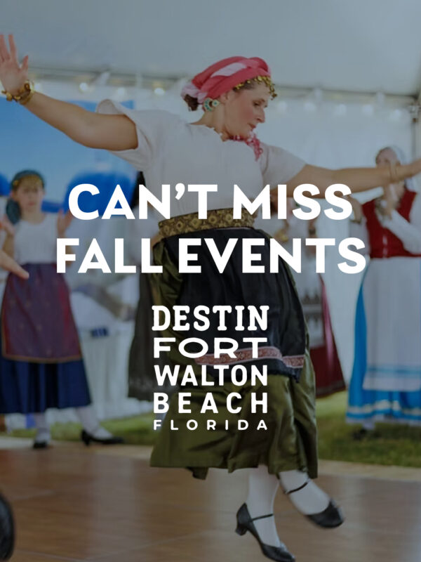 Woman in traditional dress dances at a fall event; other dancers in similar attire perform in the background. Text promotes fall events in Destin-Fort Walton Beach, Florida.